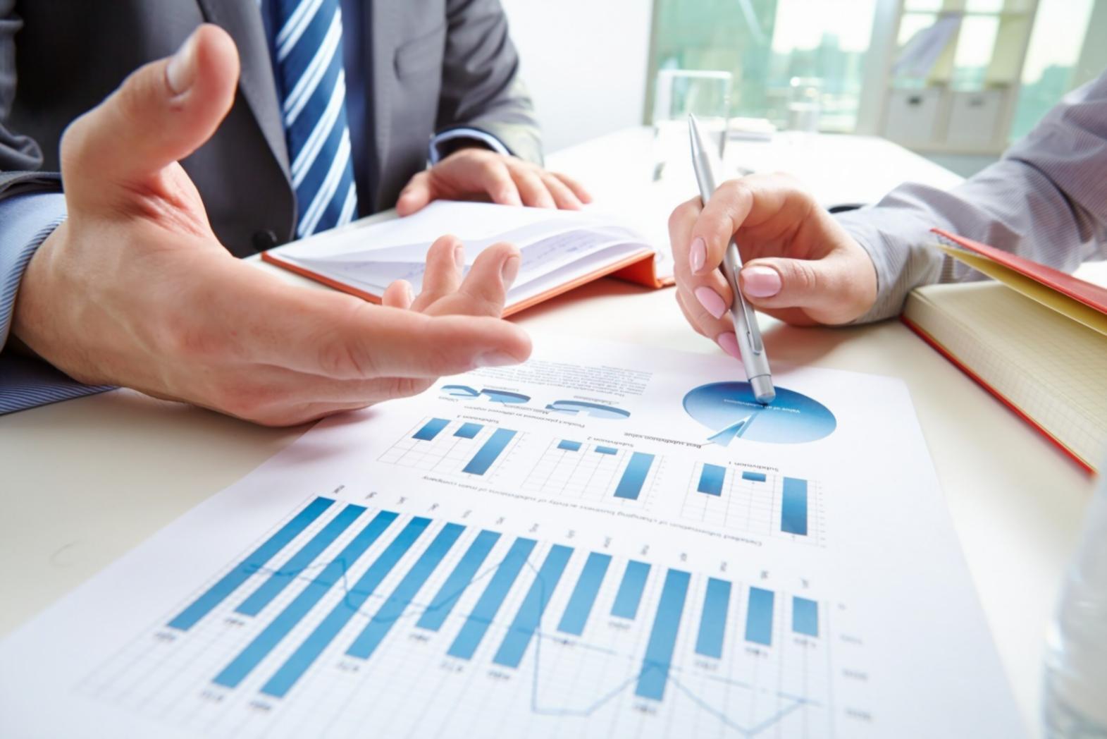 Financial analysis workspace with documents and calculator